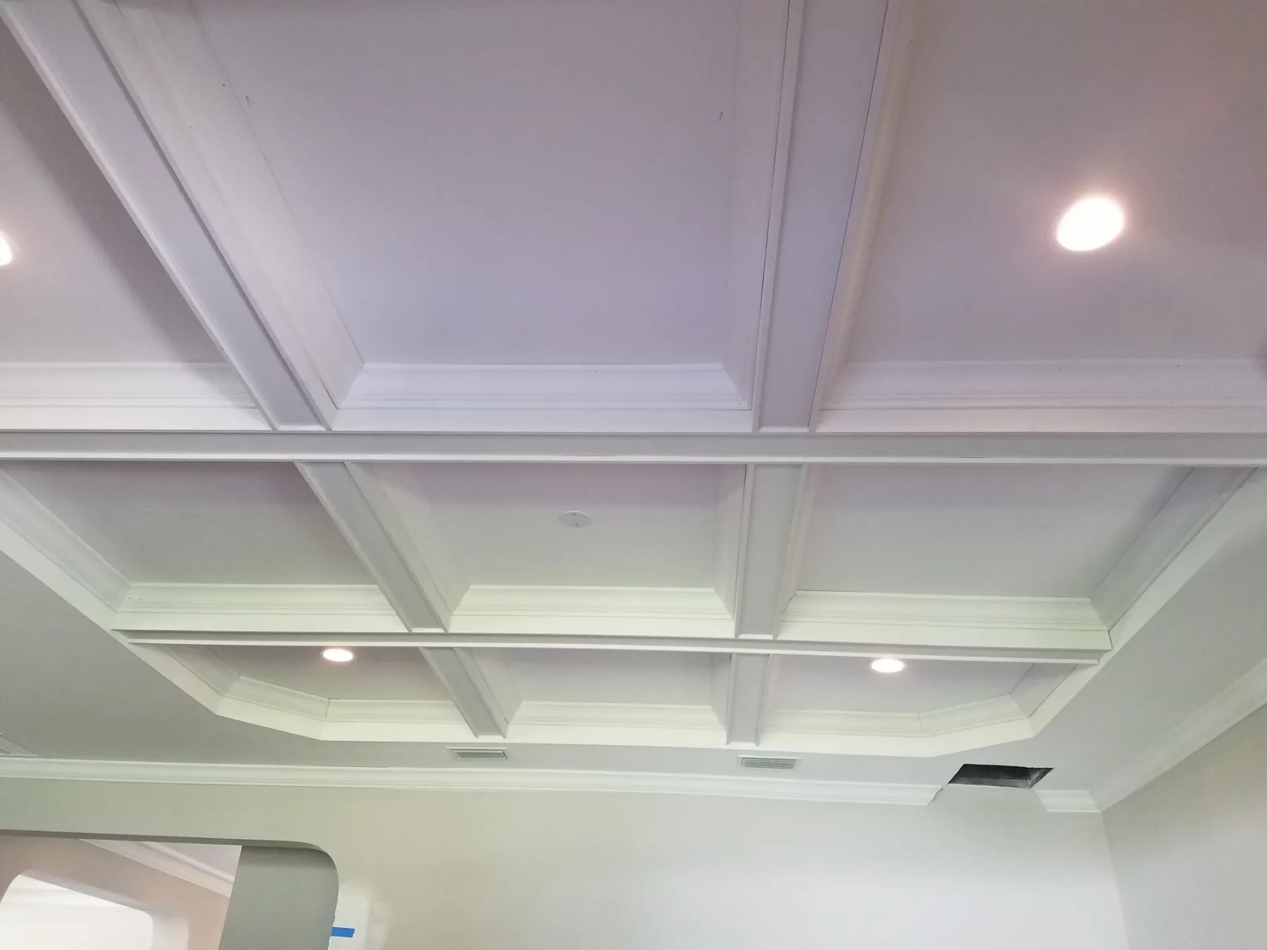 Wood ceiling beams running across a Tampa living room ceiling